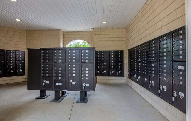 a view of the mailboxes in the mail room of a building