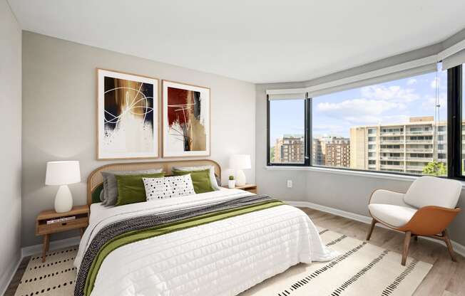a bedroom with a large bed and a large window