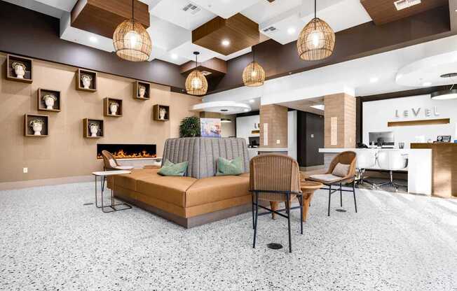 A living room with a brown sofa and a grey couch.