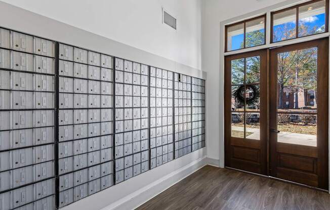 A wall of electrical outlets with a wreath on the door.