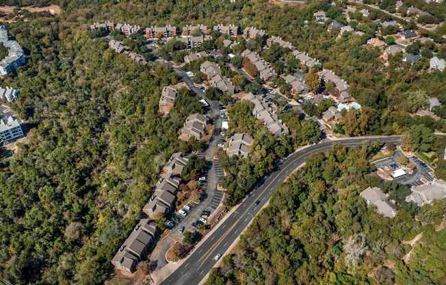 Road with houses on both sides at Great Hills, Austin Texas