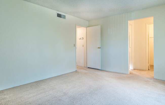 Cottonwood Creek master bedroom with carpet flooring. 