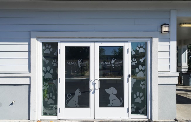 the doors to the veterinary clinic are decorated with images of bunnies and flowers