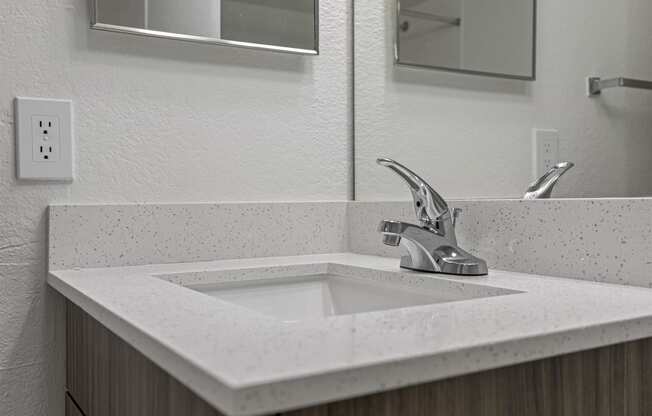 a bathroom with a sink and a mirror