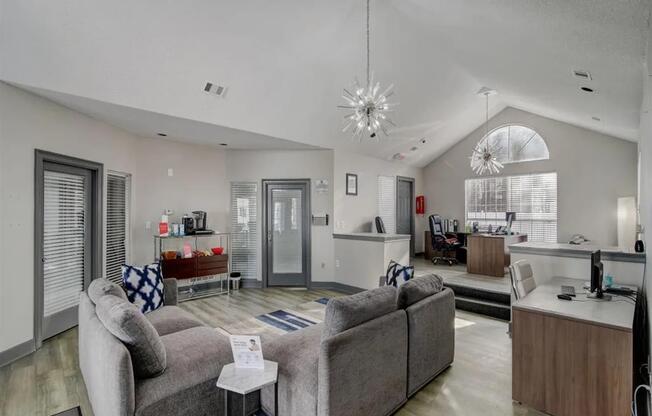 a living room with couches and a table at The Sapphire, Decatur