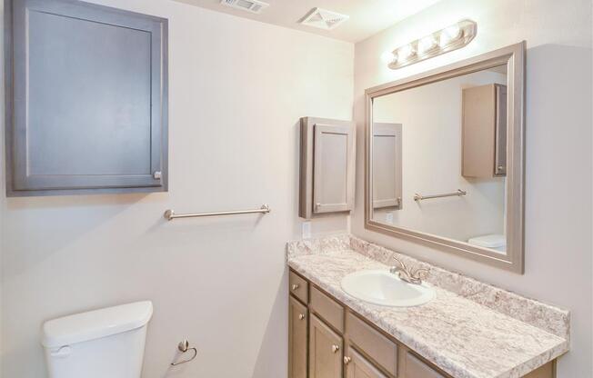 Mirrored vanity of Saxony at Chase Oaks in North Plano, TX, For Rent. Now leasing 1, 2 and 3 bedroom apartments.