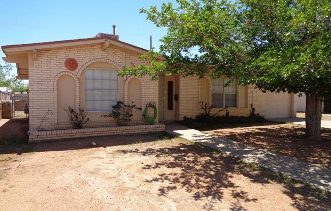 Cute Single Level Northeast Home With Evaporative Air Located In Quiet Neighborhood