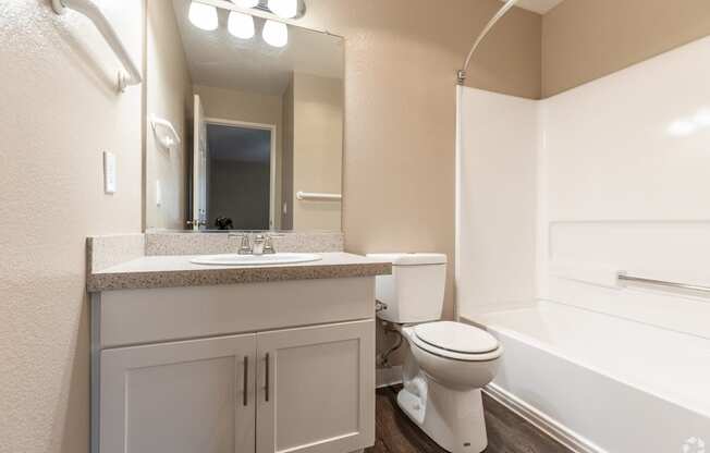  apartment bathroom with sink toilet and tub