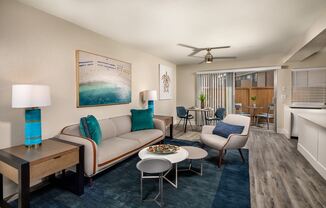 Oceanside CA Apartments - Stone Arbor - Spacious Living Room with Wood-Style Flooring and Attached Private Patio