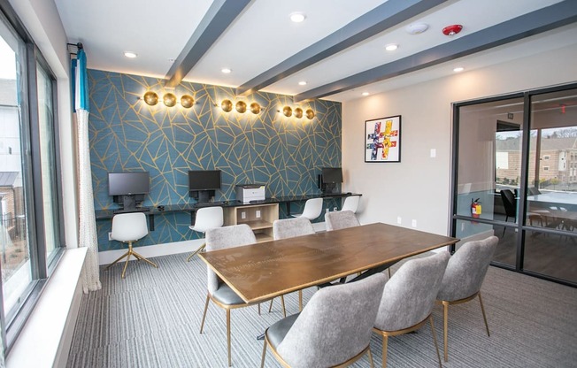 A conference room with a long table and chairs.