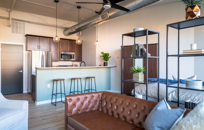 a kitchen and living room in a 555 waverly unit at The 22 Apartments, St. Louis, MO