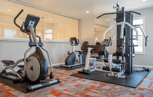 an image of the gym at the enclave at woodbridge apartments in sugar land, tx