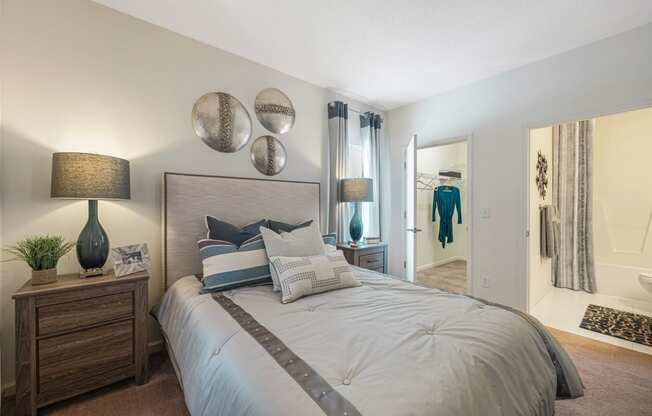 our apartments offer a bedroom with a large bed and a walk in closet