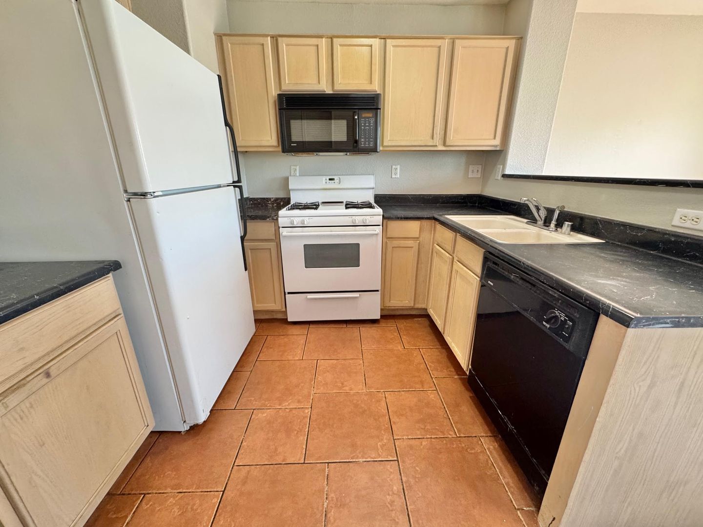 THIS IS A CHARMING TWO-STORY NORTH LAS VEGAS HOME WITH 2 BEDROOMS, 2.5 BATHS AND A TWO-CAR ATTACHED GARAGE. FEATURING TILE AND CARPET FLOORING, NEUTRAL PAINT, AND BLINDS THROUGHOUT, THE MAIN LEVEL OFFERS AN OPEN LIVING AND DINING AREA THAT FLOWS INTO A KI