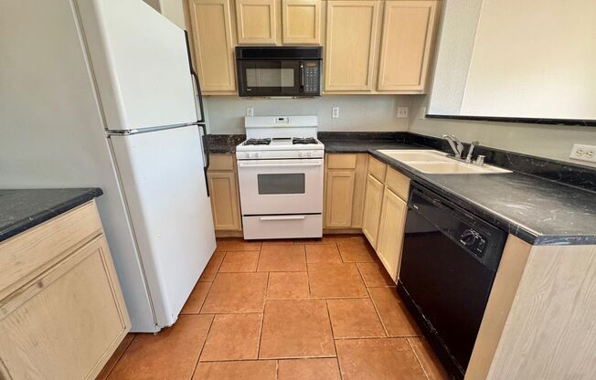 THIS IS A CHARMING TWO-STORY NORTH LAS VEGAS HOME WITH 2 BEDROOMS, 2.5 BATHS AND A TWO-CAR ATTACHED GARAGE. FEATURING TILE AND CARPET FLOORING, NEUTRAL PAINT, AND BLINDS THROUGHOUT, THE MAIN LEVEL OFFERS AN OPEN LIVING AND DINING AREA THAT FLOWS INTO A KI