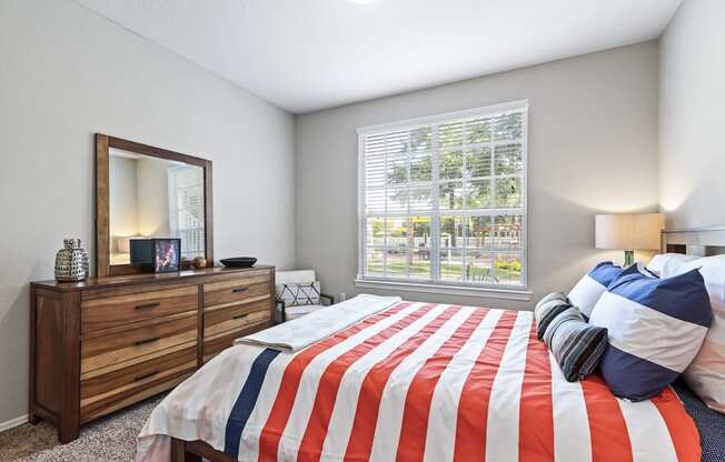 Bedroom with Grey Walls and Plush Carpeting