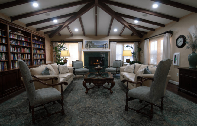 A cozy living room with a fireplace and comfortable seating.,A cozy living room with a fireplace and comfortable seating.
