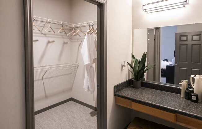 a bathroom with a shower and a sink and a mirror