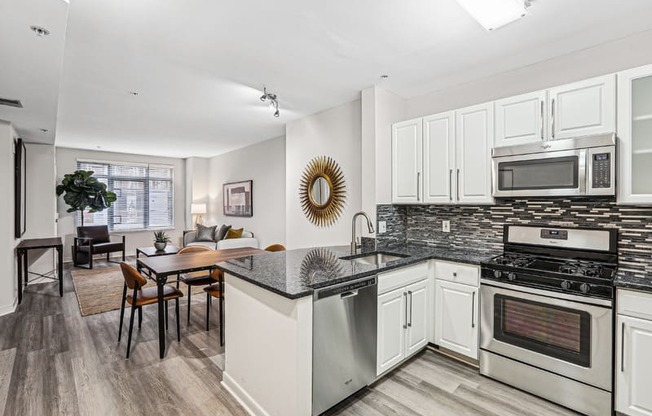 a kitchen with an island and a dining table