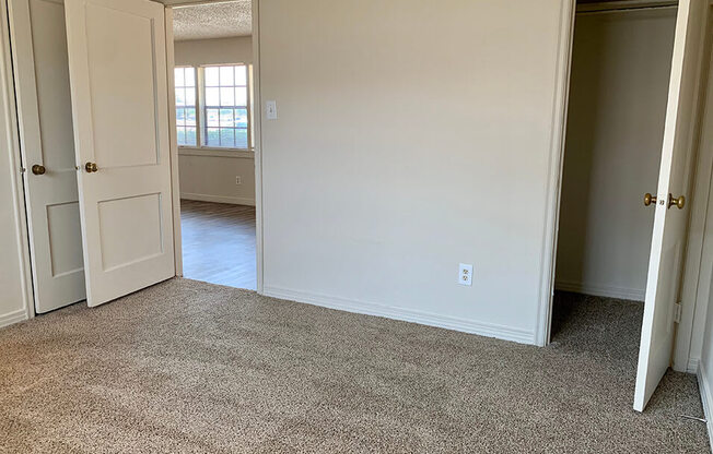 an empty room with a door open