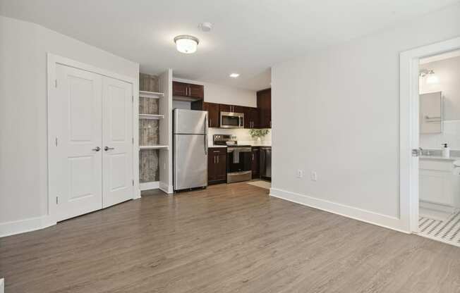 a kitchen and living room in a studio apartment