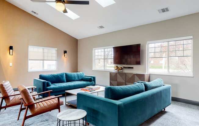 Casual sitting area with TV at the community clubhouse at The Northbrook Apartments