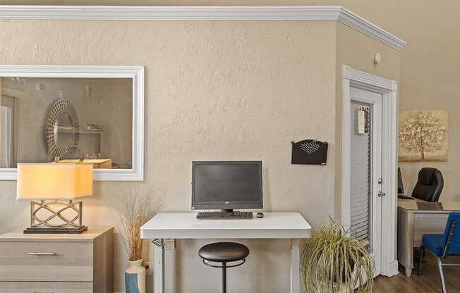 a home office with a computer on a desk