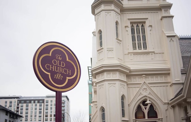 the old church sign in front of a building