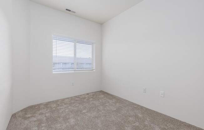 an empty room with a window and carpet  at Shoreline Village, Washington