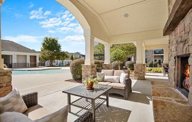 A patio with a table and chairs is shown.