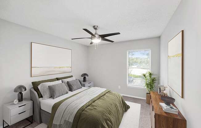 Model Bedroom with Carpet and Window View at Vue at Baymeadows Apartments in Jacksonville, FL.