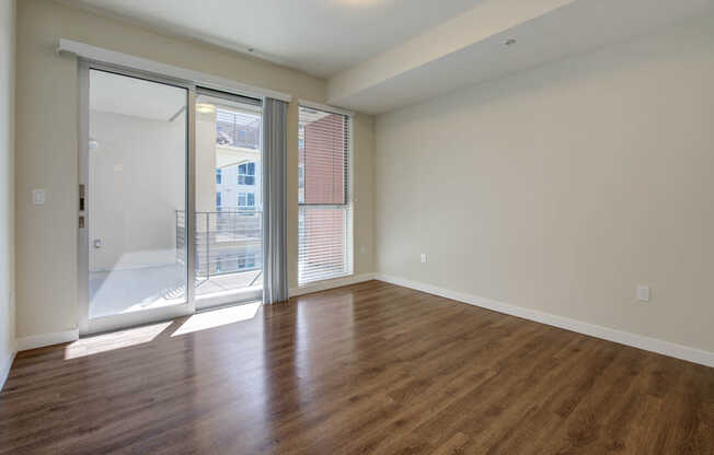 Bedroom with Balcony and Hard Surface Flooring