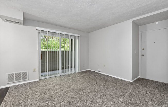 living room with a door to a balcony