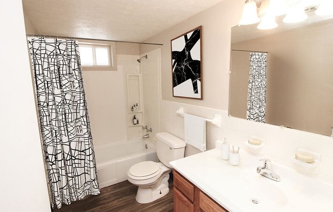 a bathroom with a toilet sink and bathtub