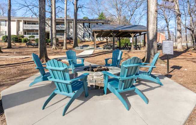 A set of six blue chairs are arranged around a table.