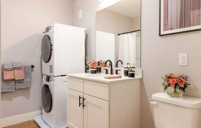 A white washer and dryer in a laundry room.