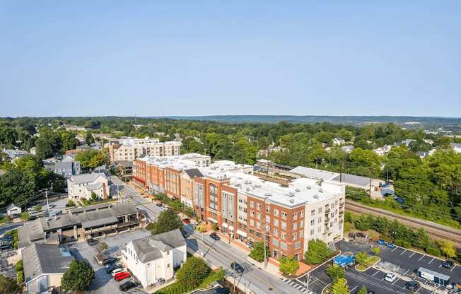 A large building with a parking lot in front of it.