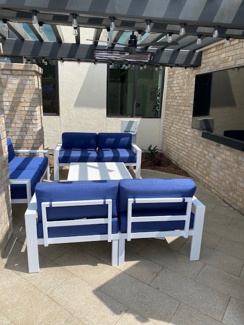 a group of blue and white chairs on a patioat Westbury Apartments, Rancho Cucamonga