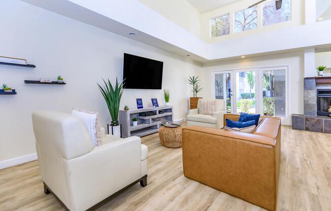 a living room filled with furniture and a large window