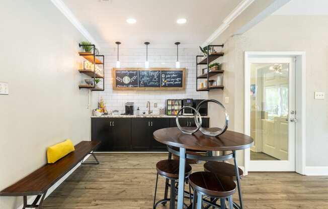 a kitchen and dining room with a table and chairs