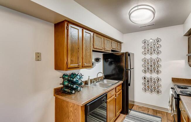 a kitchen with a stove top oven sitting inside of a room