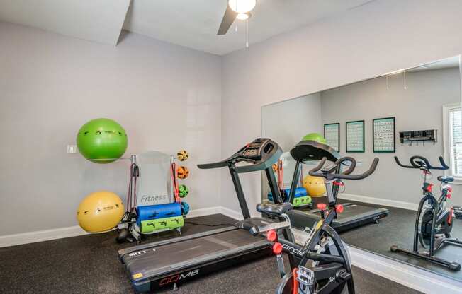 plenty of exercise equipment at the whispering winds apartments in pearland, tx