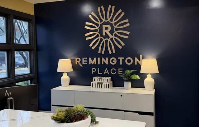 A reception area with a counter and a sign that says Remington Place.