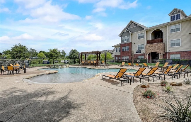 the preserve at ballantyne commons community pool and hot tub with apartment buildings in the background