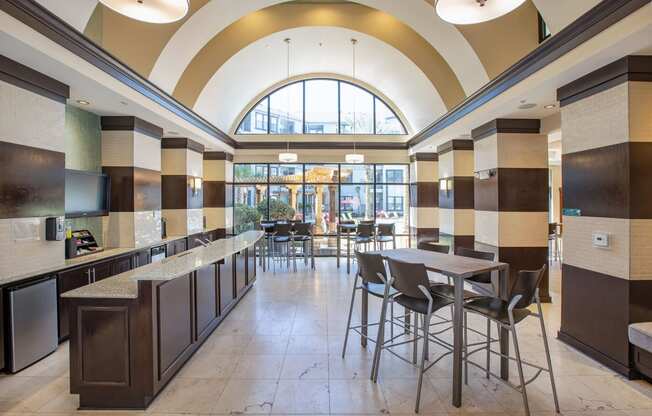 Clubhouse Cafe with seating area. Granite counter top area holds kitchen sink.
