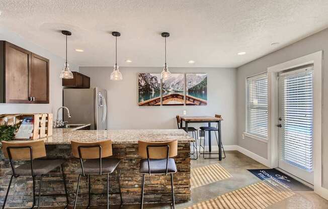 Apartments Near Happy Valley For Rent - Sunnyside Village - Clubhouse With Seating Area and Island Table
