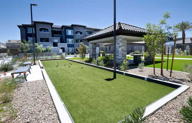 Community bocce ball court near a Ramada and BBQ