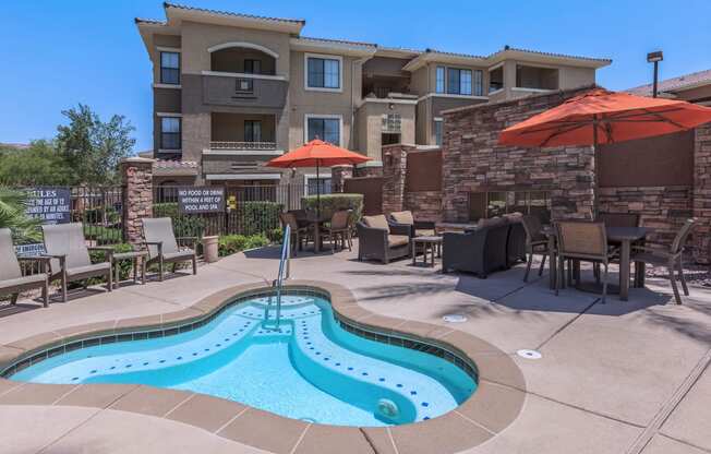 Swimming Pool Area With Shaded Chairs at The Presidio by Picerne, N Las Vegas, NV, 89084