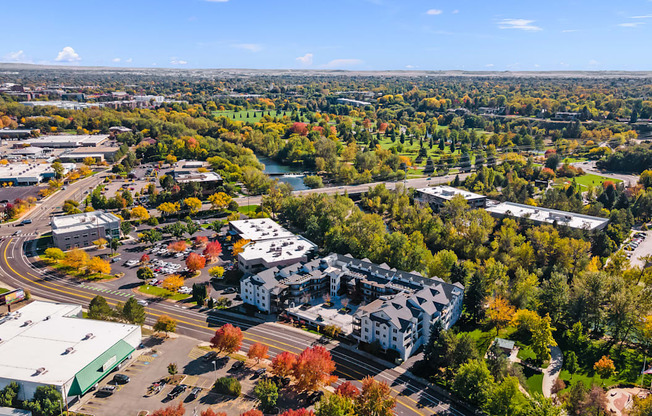an aerial view of a city with trees and buildings