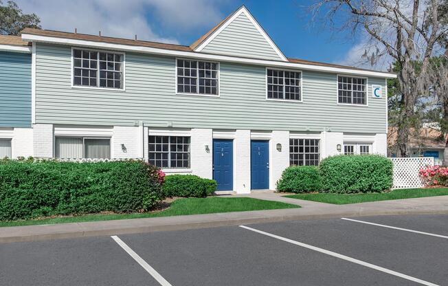 an empty road in front of a house